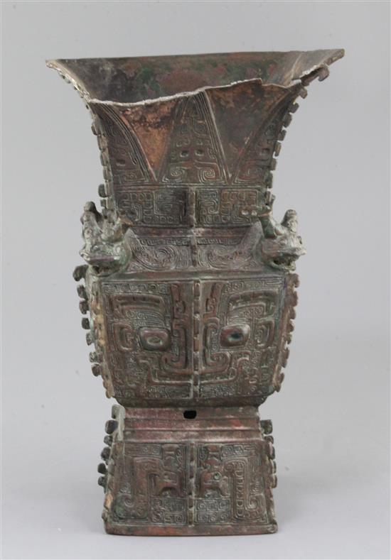 A rare Chinese archaic bronze ritual wine vessel, Fangzun, Shang dynasty, 13th-11th century B.C., 33.5cm high, losses and repairs